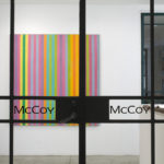 gallery installation of abstract paintings